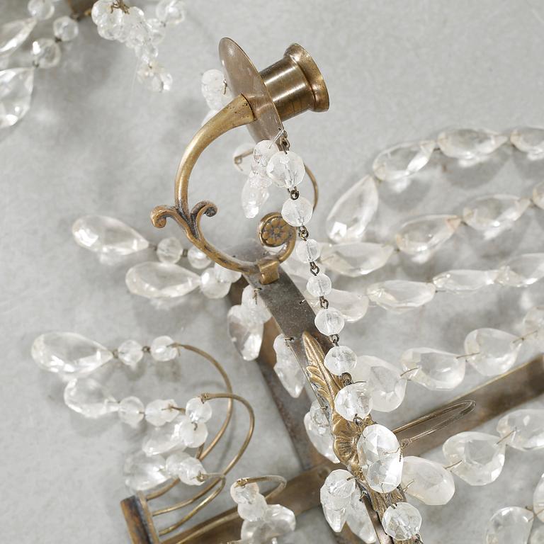 A pair of wall chandeliers from the first half of the 20th century.