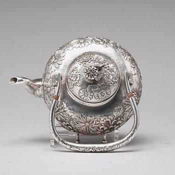 A Japanese silver tea pot with burner and stand, makers mark Samurai Shokai, Yokohama, Sterling.