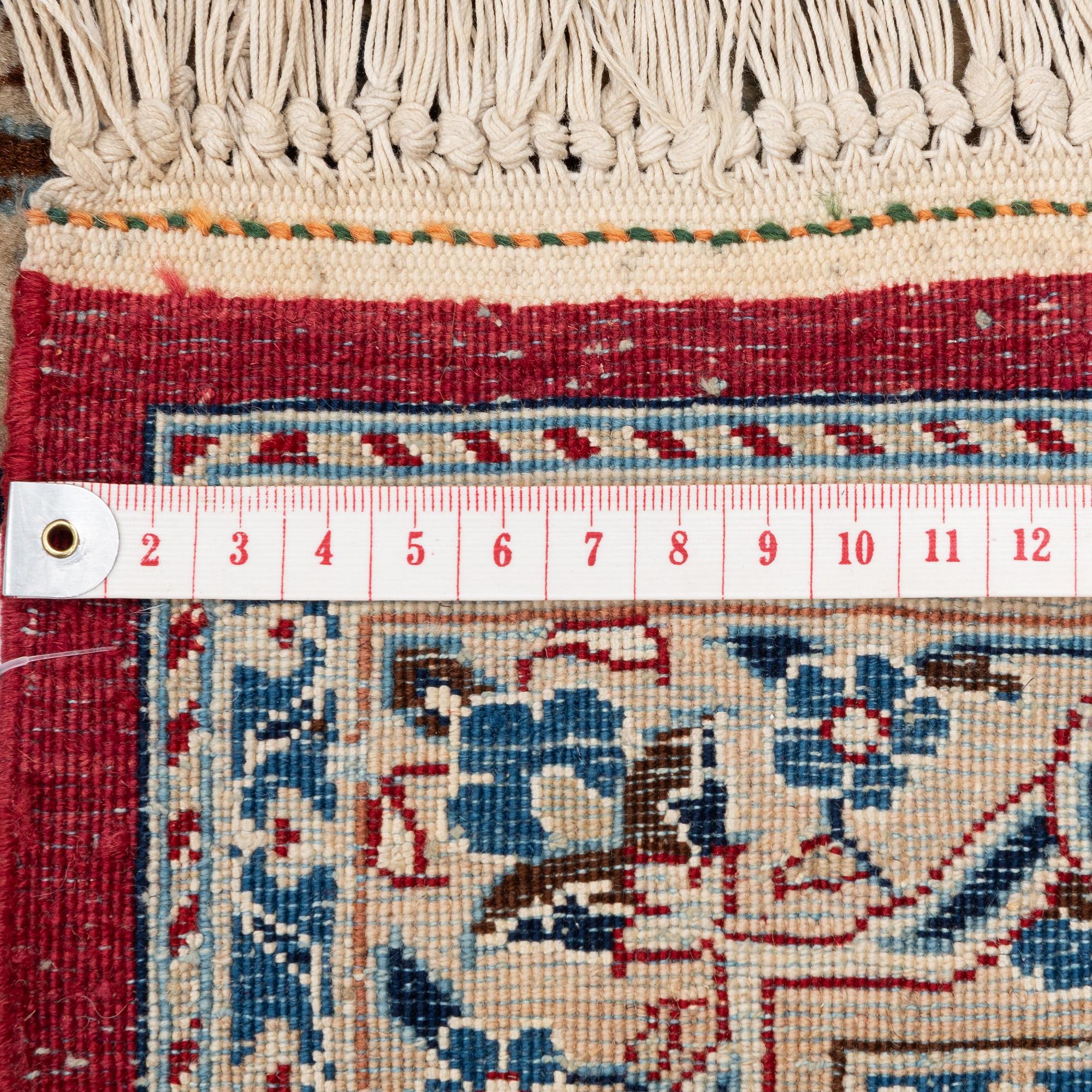 A semi-antique Nain Tudeshk carpet, c. 307 x 206 cm.