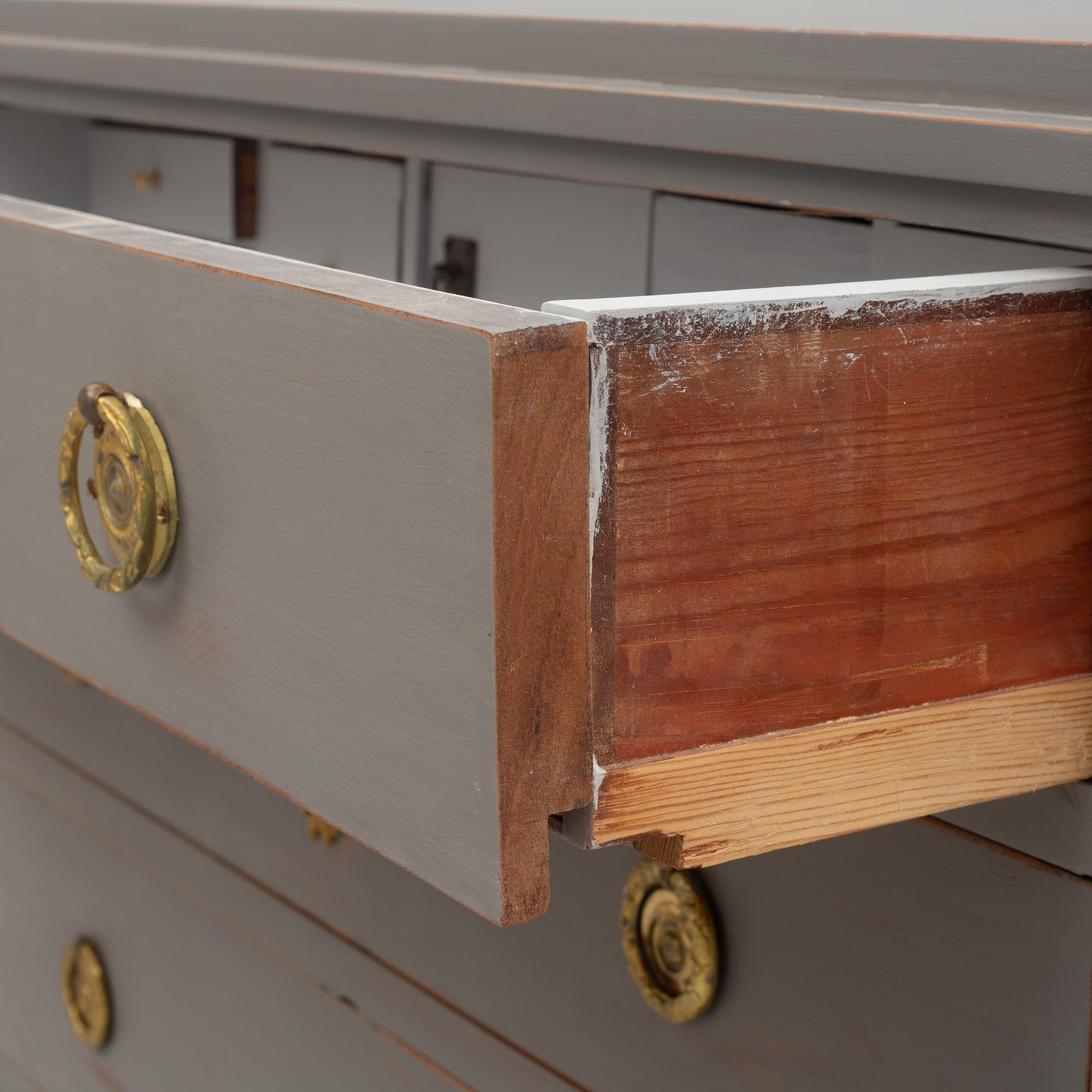 A Gustavian style chest of drawers, early 20th century.