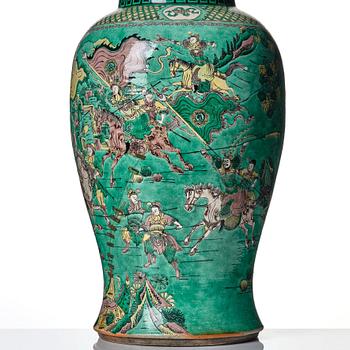 A massive famille verte bisquit vase, Qing dynasty with Kangxi mark to base.