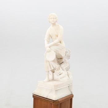 Decorative sculpture Seated woman with tambourine.