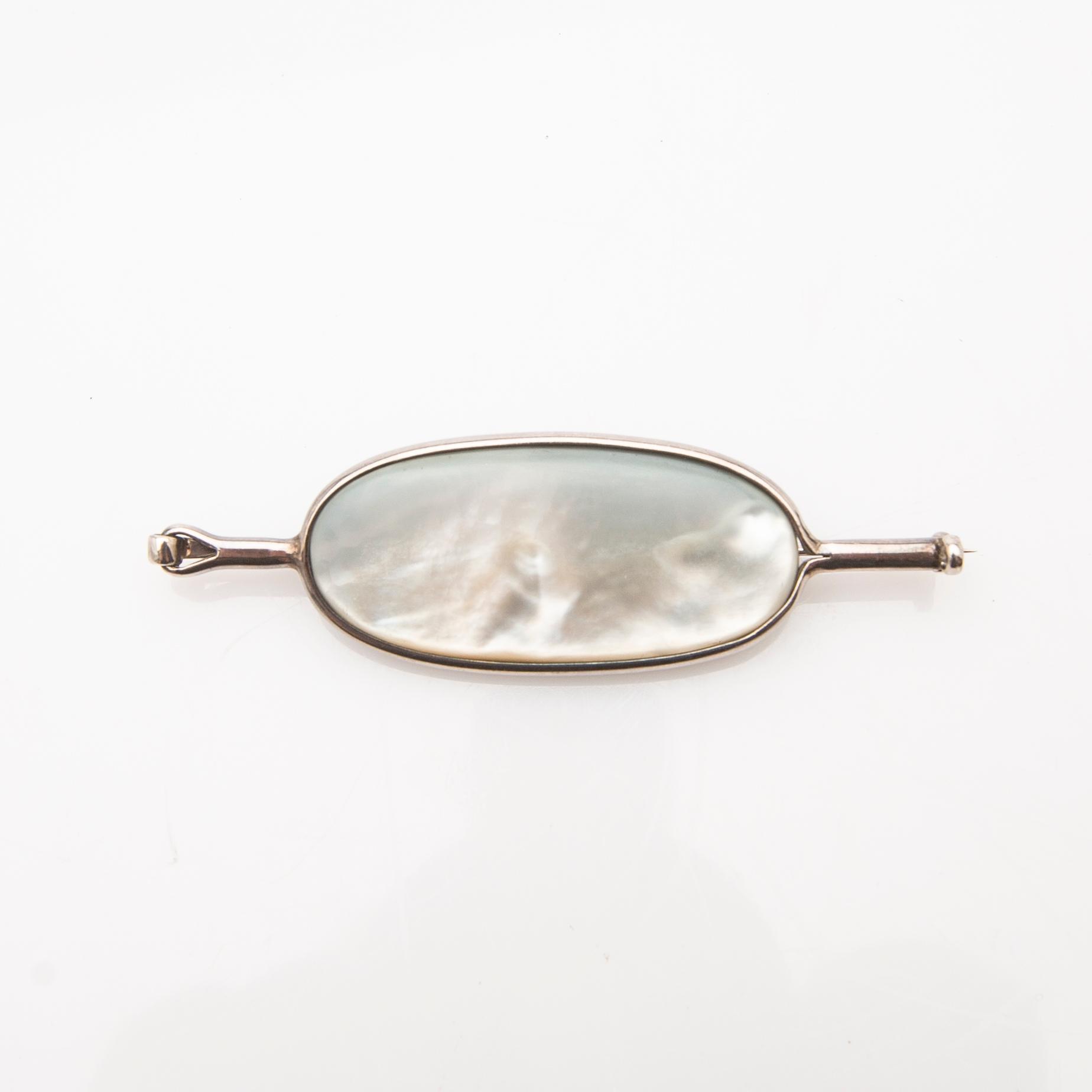 Vivianna Torun Bülow-Hübe, brooch, silver with mother-of-pearl and obsidian.