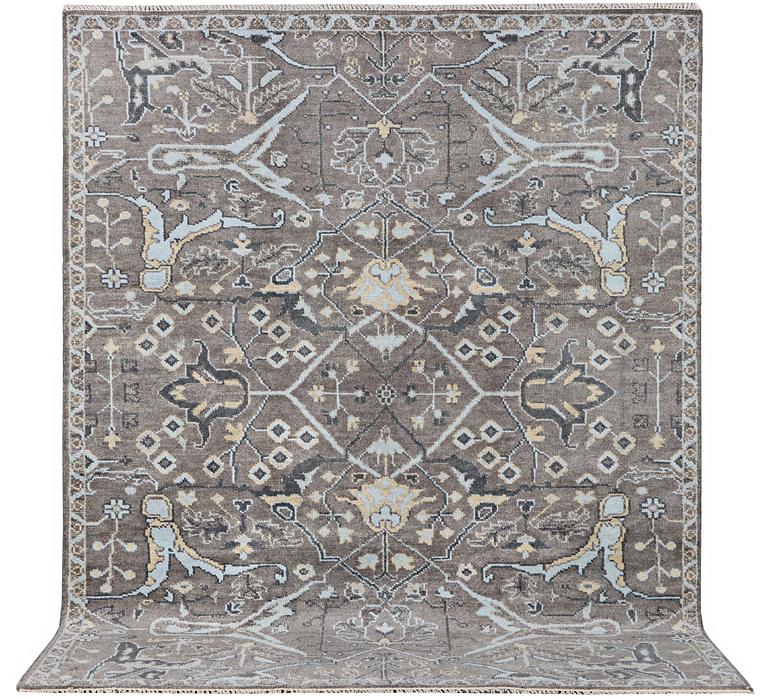An Oriental carpet with Mamluk design, c. 303 x 246 cm.