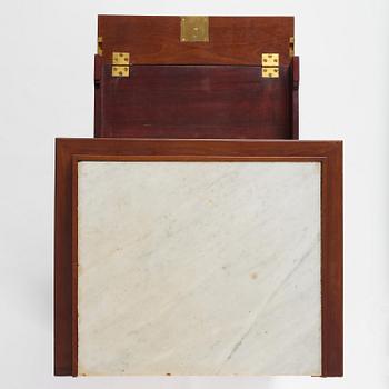 A late Gustavian mahogany column-cabinet, Stockholm, circa 1800.