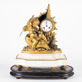 A Louis XVI-style gilt zink and marble mantel clock, later part of the 19th Century.