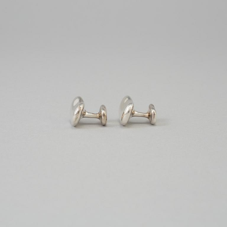 A pair of sterling cufflinks by Elsa Peretti for Tiffany & co.