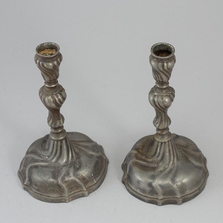 A pair of 18th century pewter candlesticks.