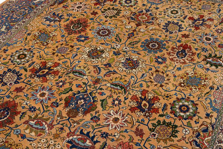 A semi-antique Tabriz carpet of vase design, West Persia, c. 404 x 292 cm.