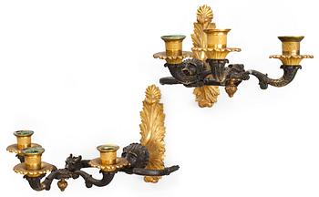A pair of French late Empire three-light wall-lights.