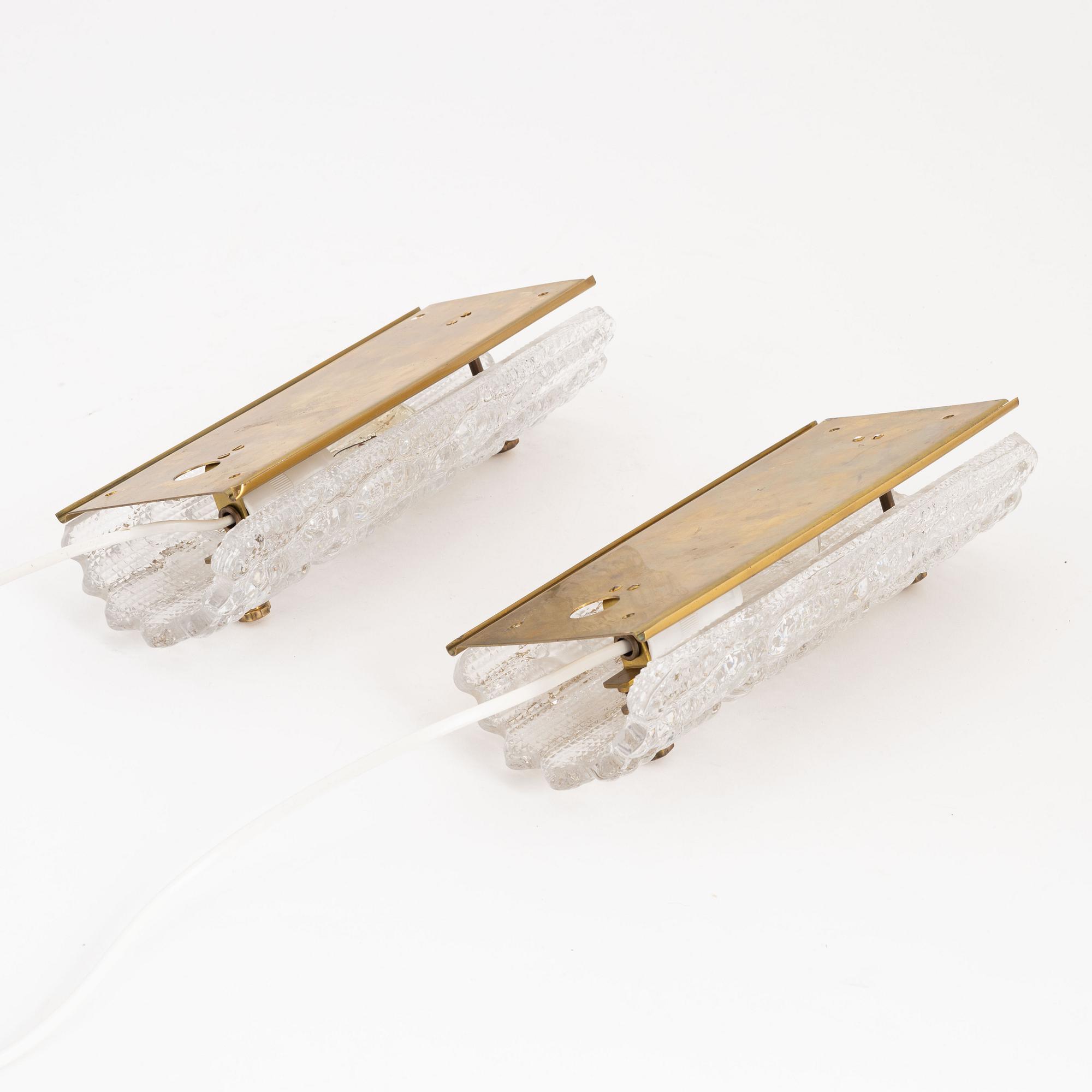 Carl Fagerlund, a pair of brass and glass wall lights, Orrefors, 1960's.