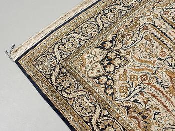 A silk Qum carpet, around  219 x 137 cm.