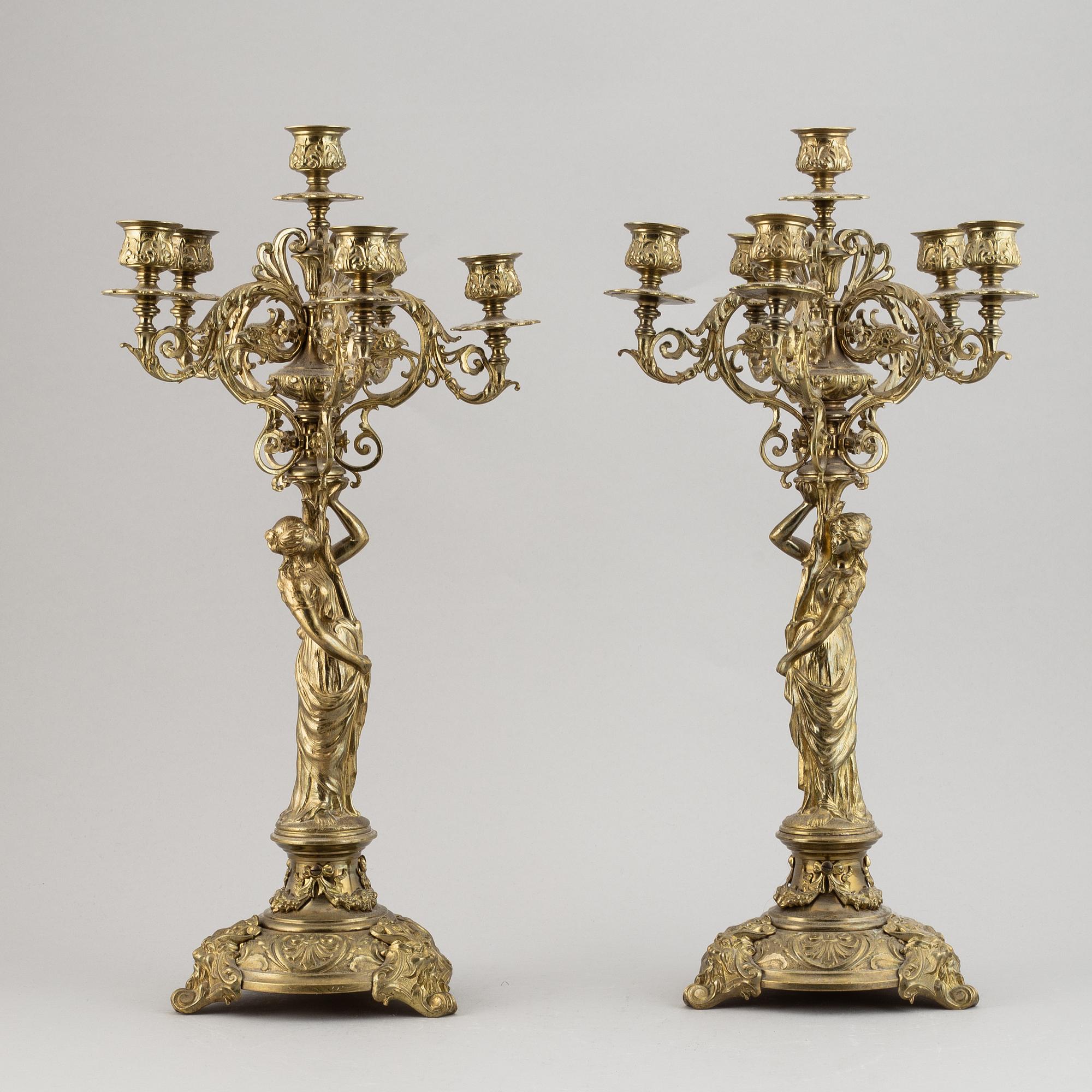 A pair of late 19th century brass candelabra for six candles.