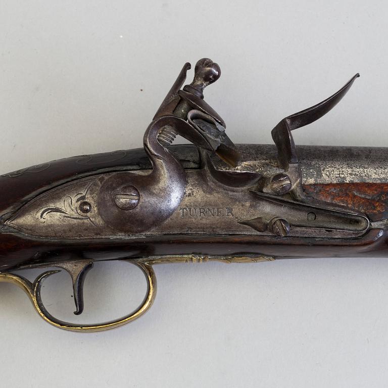 A early 19th century walnut flintlock pistol markt Turner.