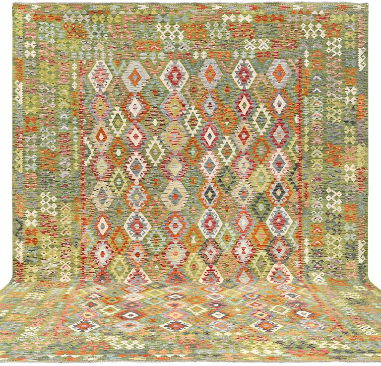 A kilim carpet, c. 504 x 369 cm.