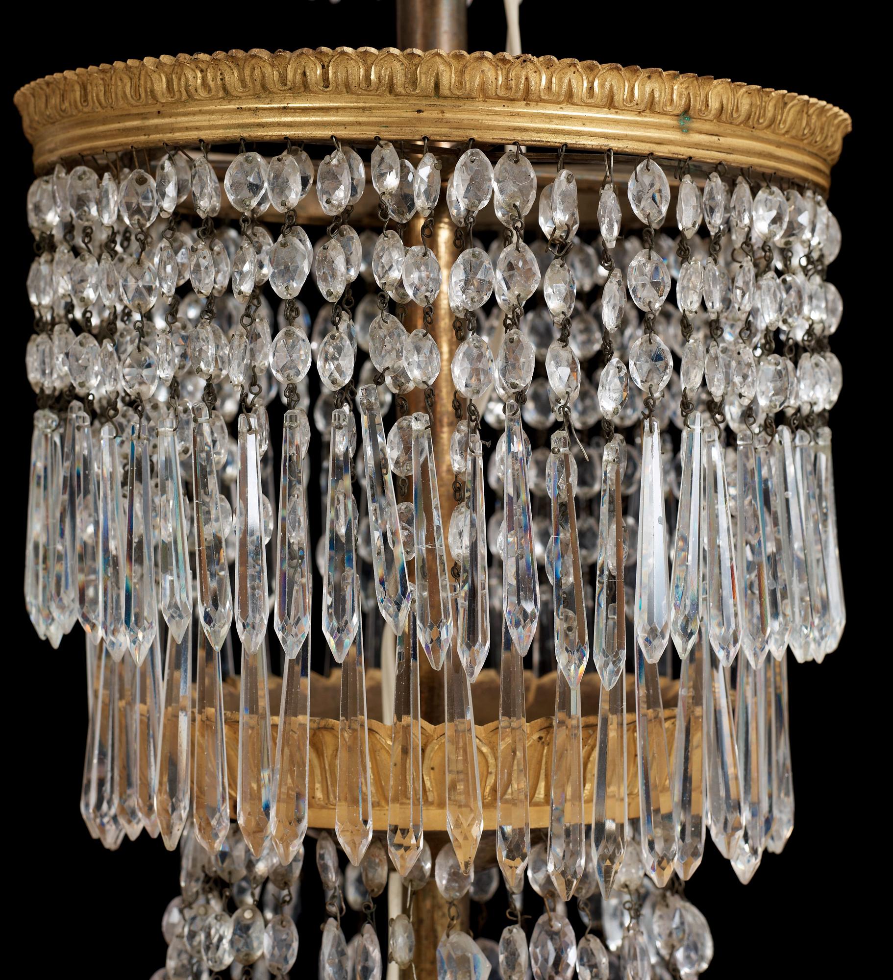 An Empire first half 19th century eighteen-light gilt bronze chandelier.