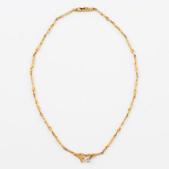 Collier Lapponia, "Vårdagg", 18K guld med en åttkantslipad diamant.