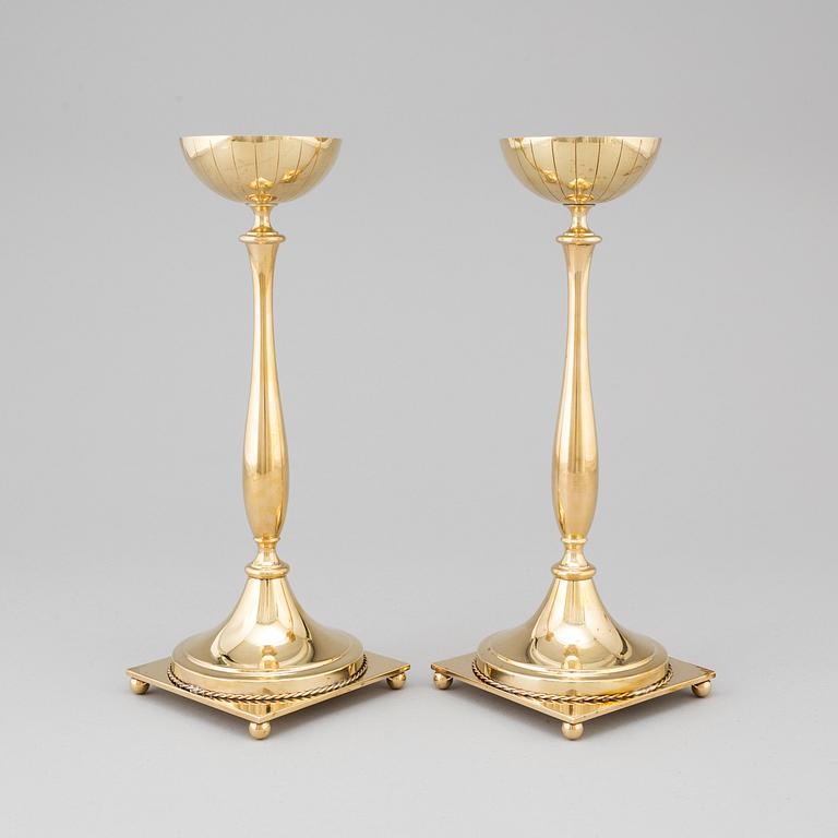 A pair of mid 20th century brass candlesticks by Gunnar Ander for Ystad Metall.