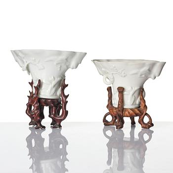 A pair of blanc de chine rhinoceros libation cups, Qing dynasty, Kangxi (1662-1722).