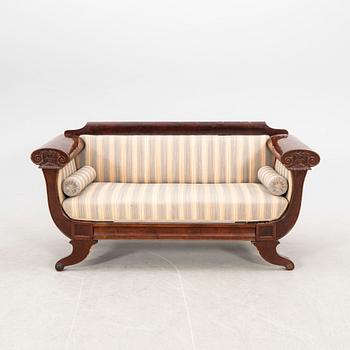A mid 1800s late Empire mahogany sofa.