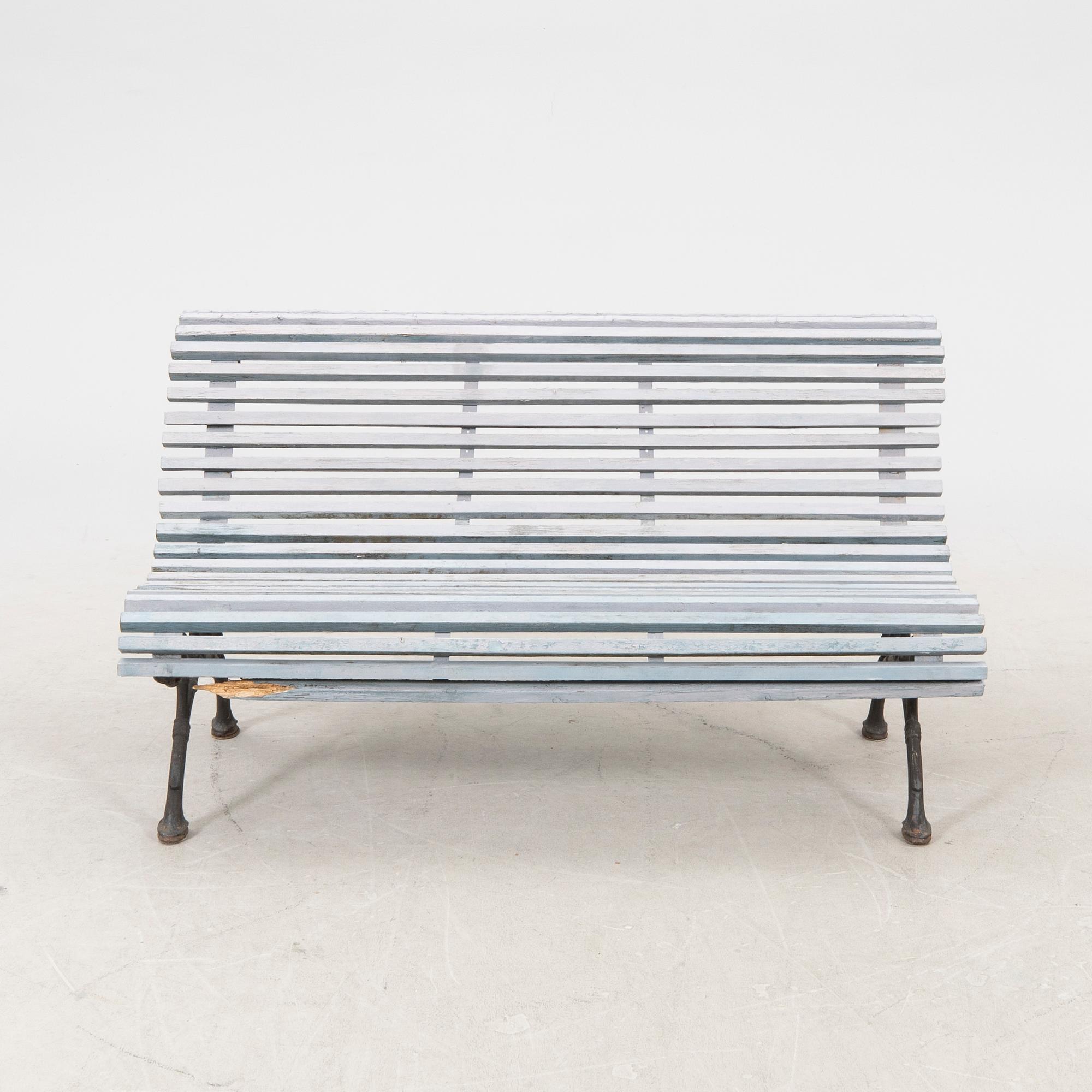 A cast iron early 1900s garden sofa.