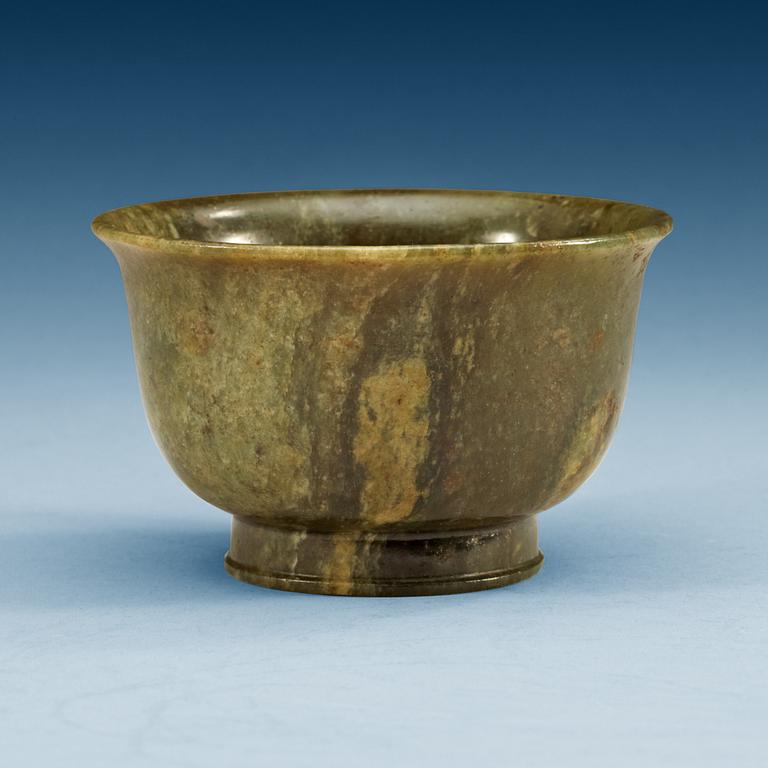 A green marble bowl, Qing dynasty (1644-1912), with Qianlong six character mark.