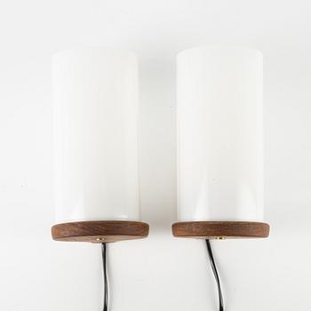 Uno & Östen Kristiansson, a pair of teak and acrylic wall lights, Luxus, Vittsjö.