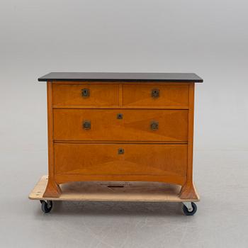 An early 20th century art nouveau chest of drawers.