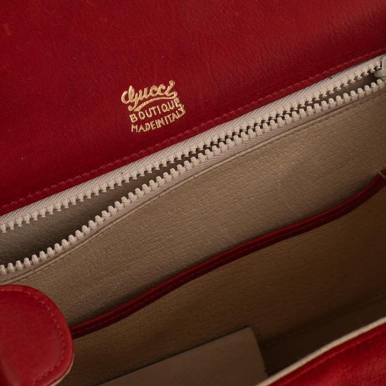 Gucci, a vintage suede bag.