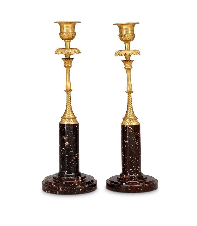 Two matched late Gustavian circa 1800 porphyry and bronze candlesticks.