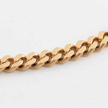 18K gold curb link necklace.