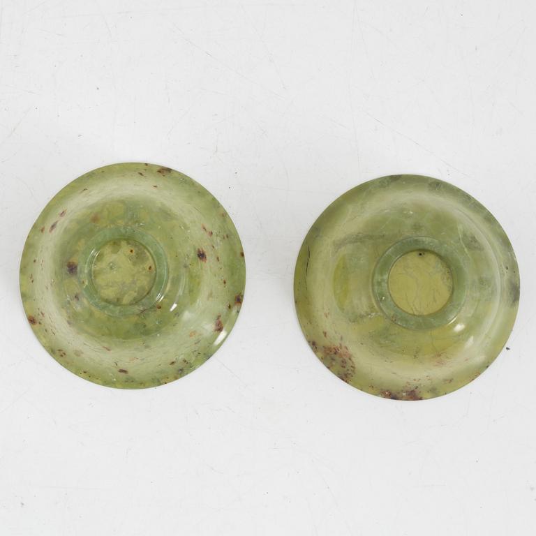 A pair of Chinese green stone bowls.