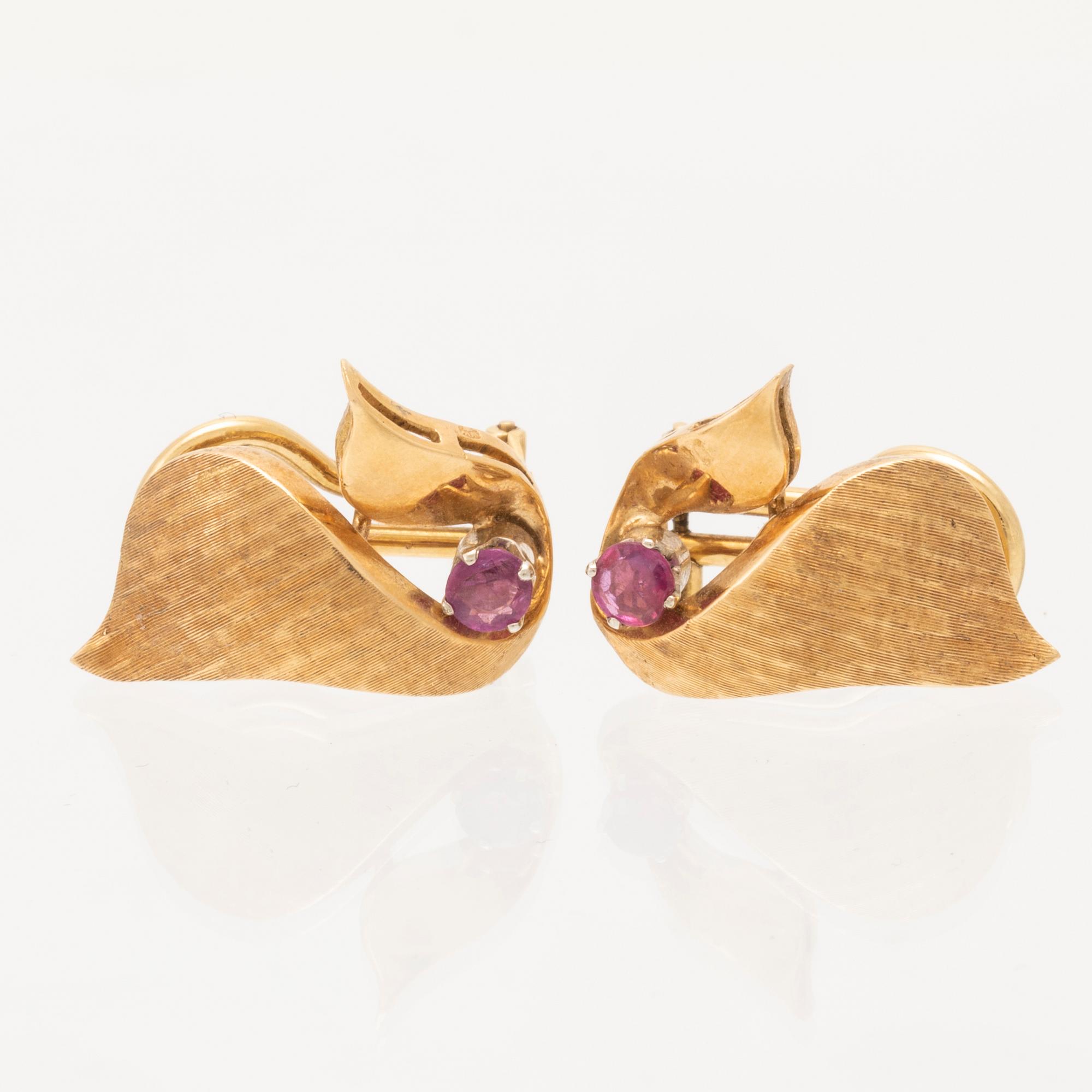 A pair of 18K gold earrings.