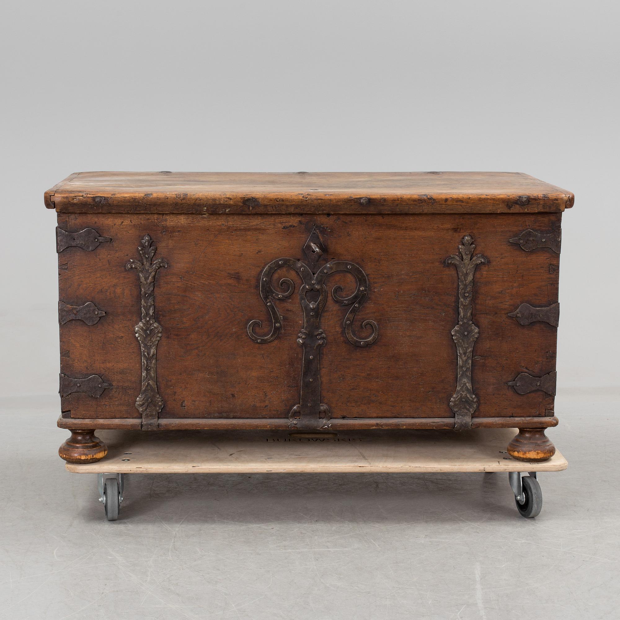 A large 17/17th century baroque oak chest with wrought iron fittings.