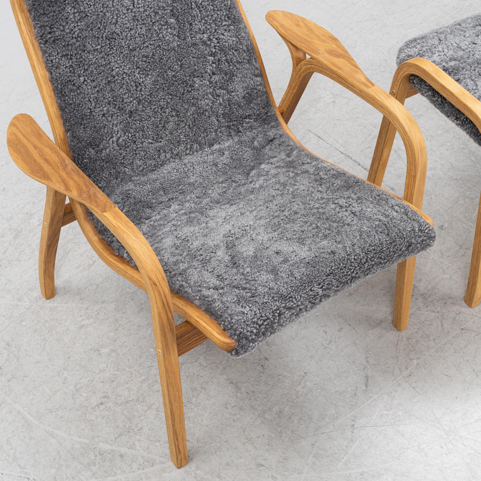 An Yngve Ekström armchair with footstool, "Lamino", Swedese, 21st century.