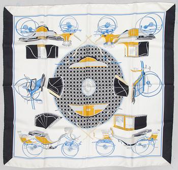 Hermès, a 'Les Voitures à Transformation' silk scarf.