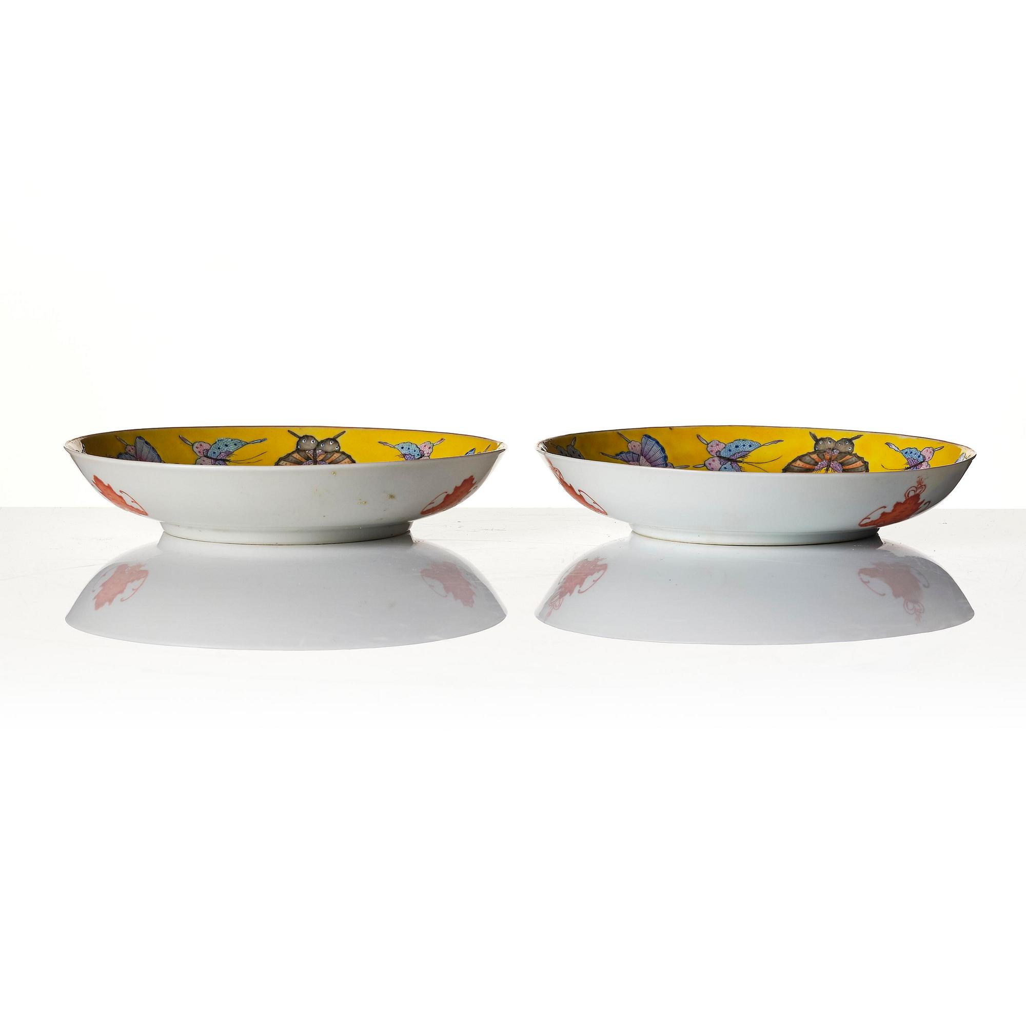 A pair of yellow ground 'butterfly' dishes, late Qing dynasty with Tongzhi mark in red.