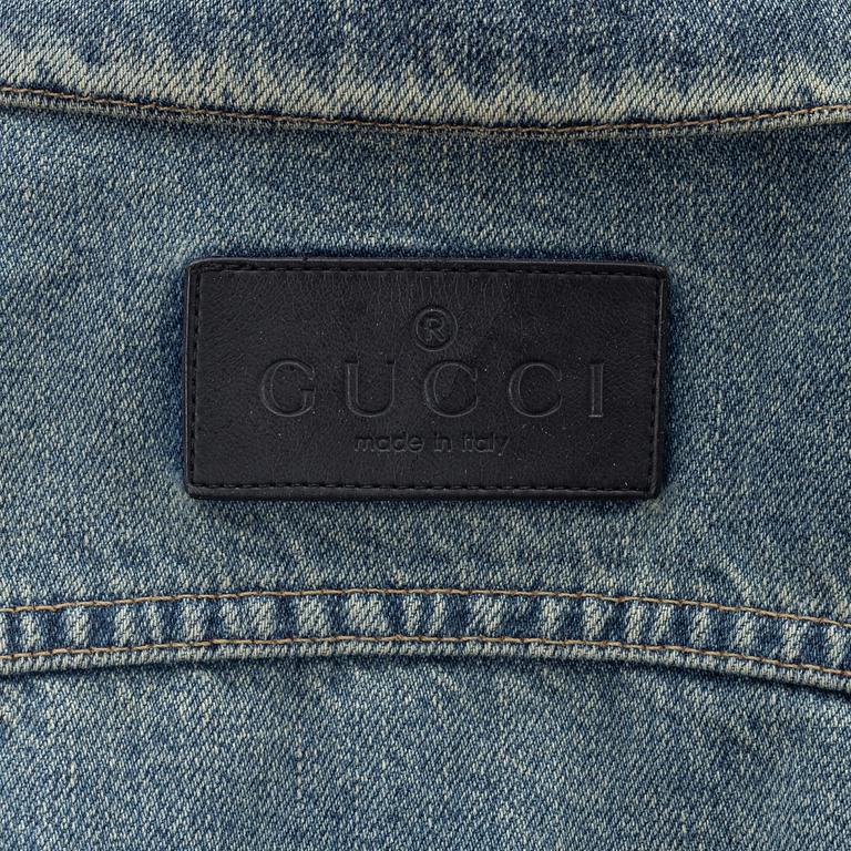 Gucci, a jeans jacket size 38.