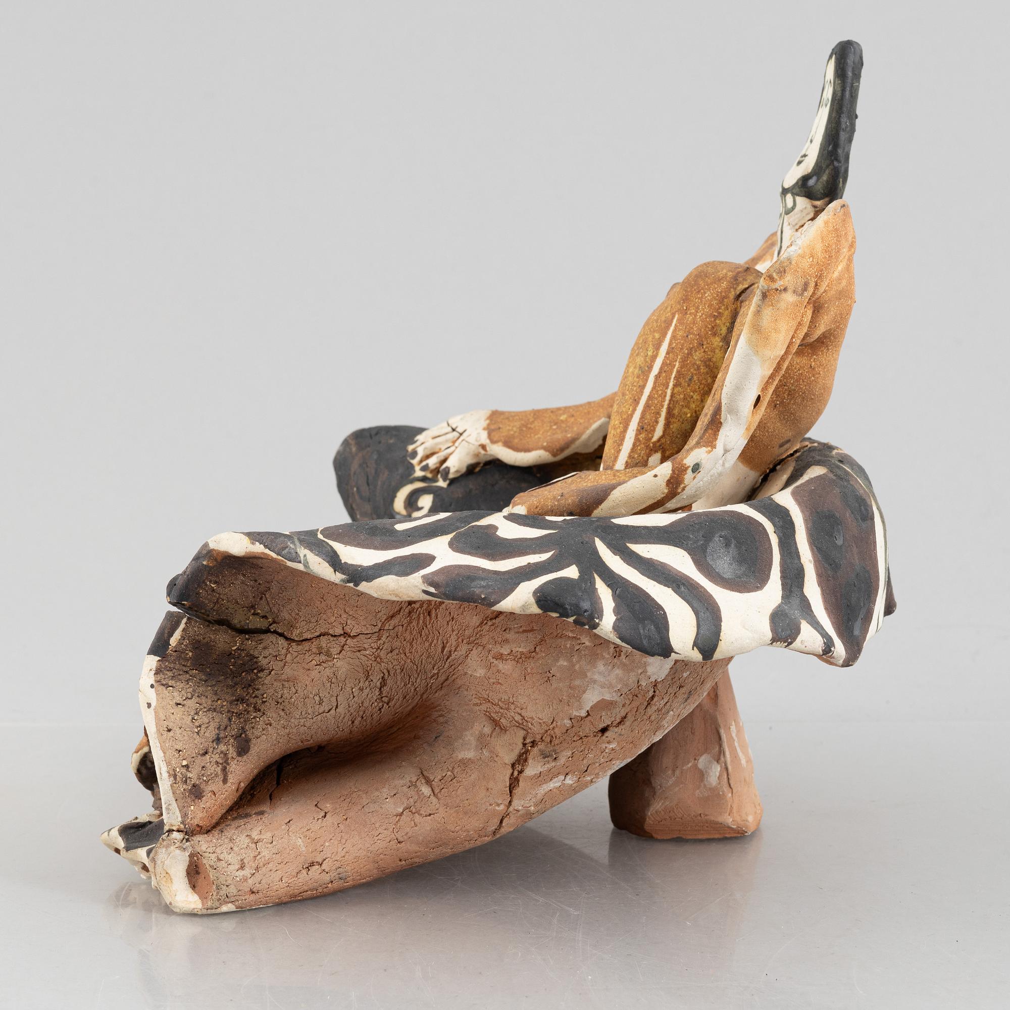 Ulrica Hydman-Vallien, a stoneware sculpture of a seated woman, executed in her own workshop, Sweden.