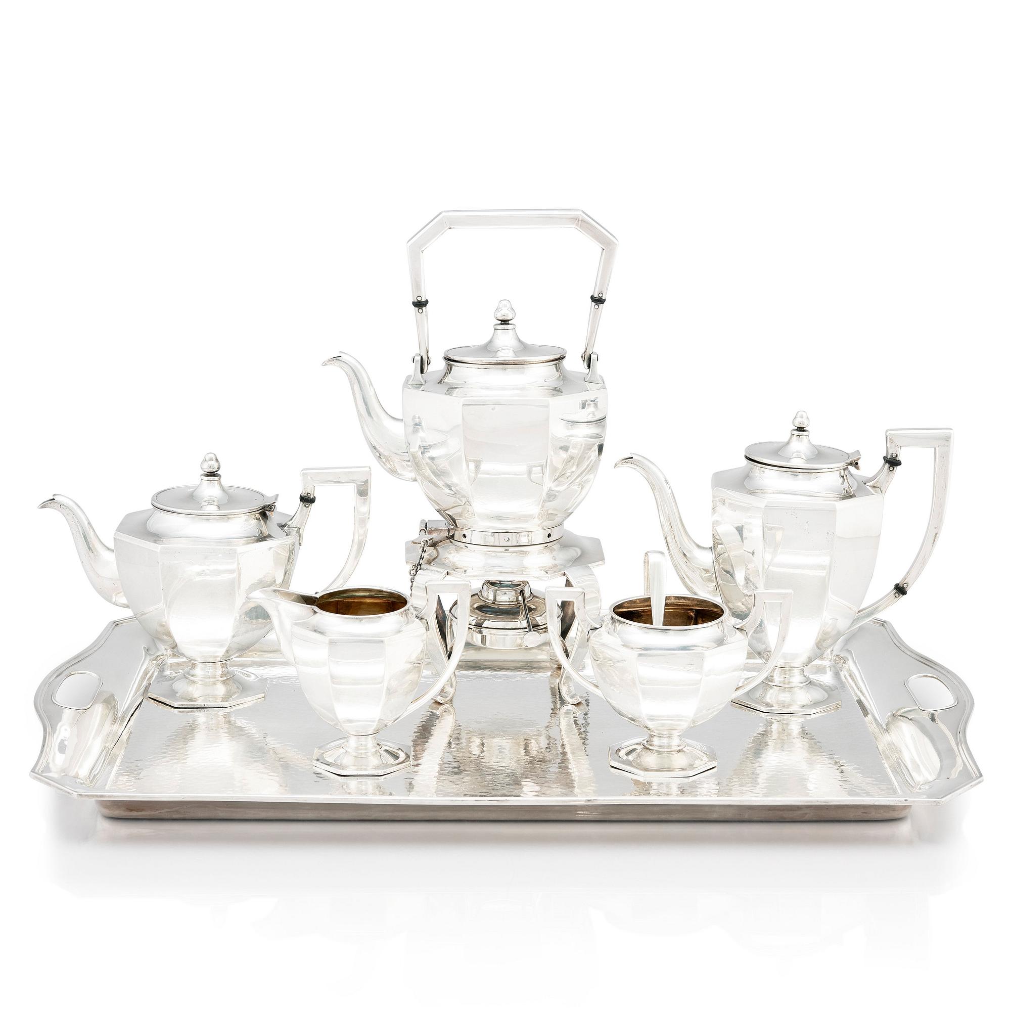 A box with a Japanese silver tea and coffee service by A box with a Japanese silver tea and coffee service by