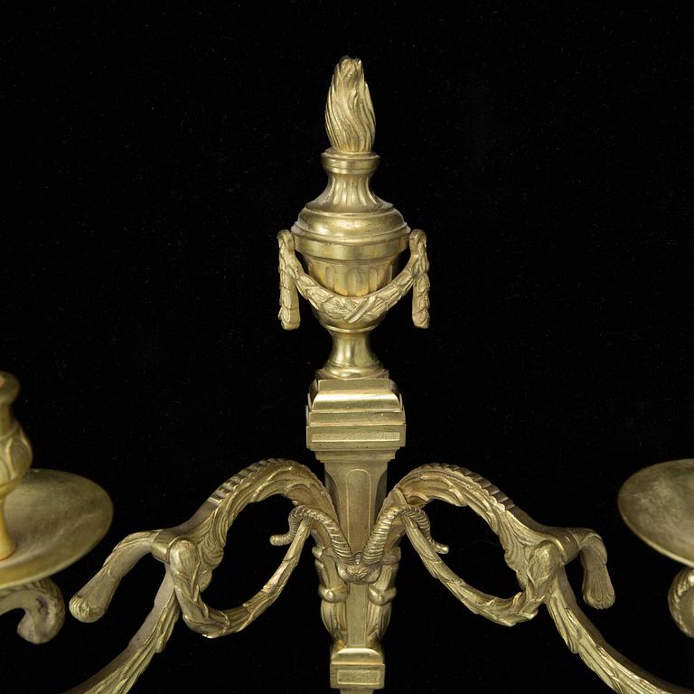 A pair of Louis XVI style brass wall appliques, first half of the 20th Century.