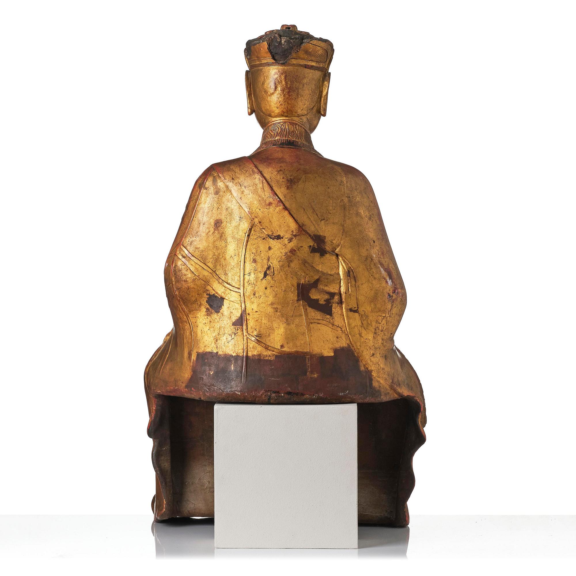 A large gilt lacquer figure of a deity, Vietnam, 19th century.