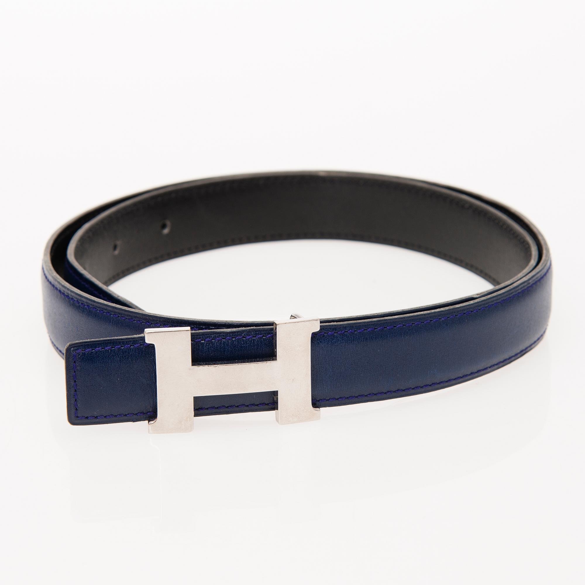 A REVERSIBLE LEATHER BELT, size 80. 1995. - Bukowskis