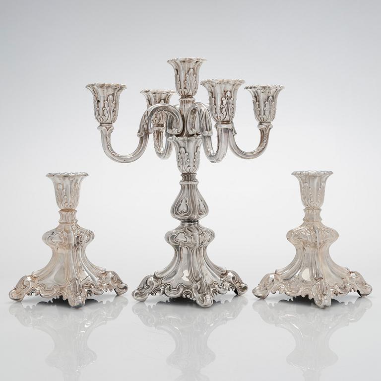 A 5-candle silver candelabra and a pair of candlesticks, silver, Auran Kultaseppä, Turku 1984.