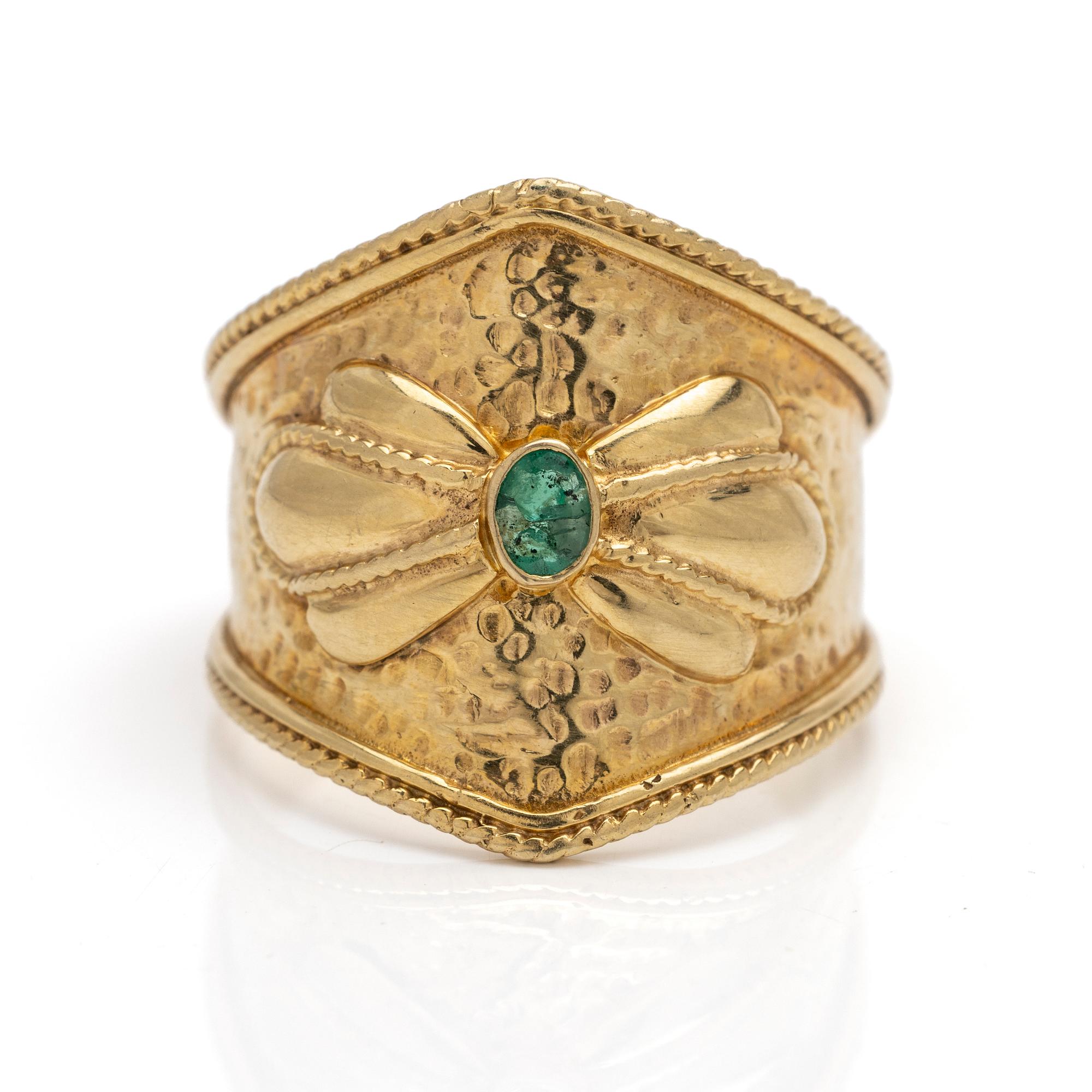 14K gold ring with an emerald.