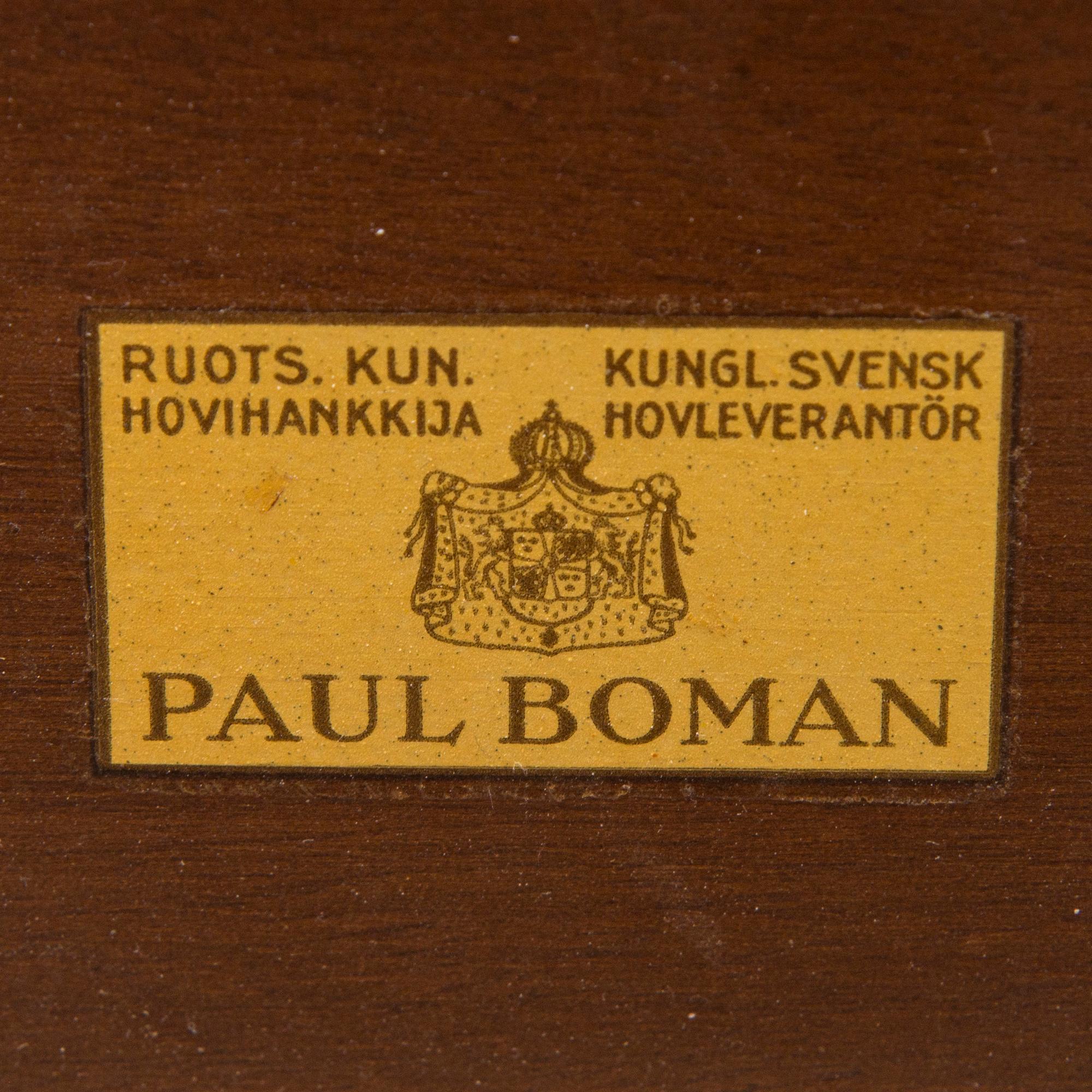 A mid 20th century conference table / dinner table marked Paul Boman.