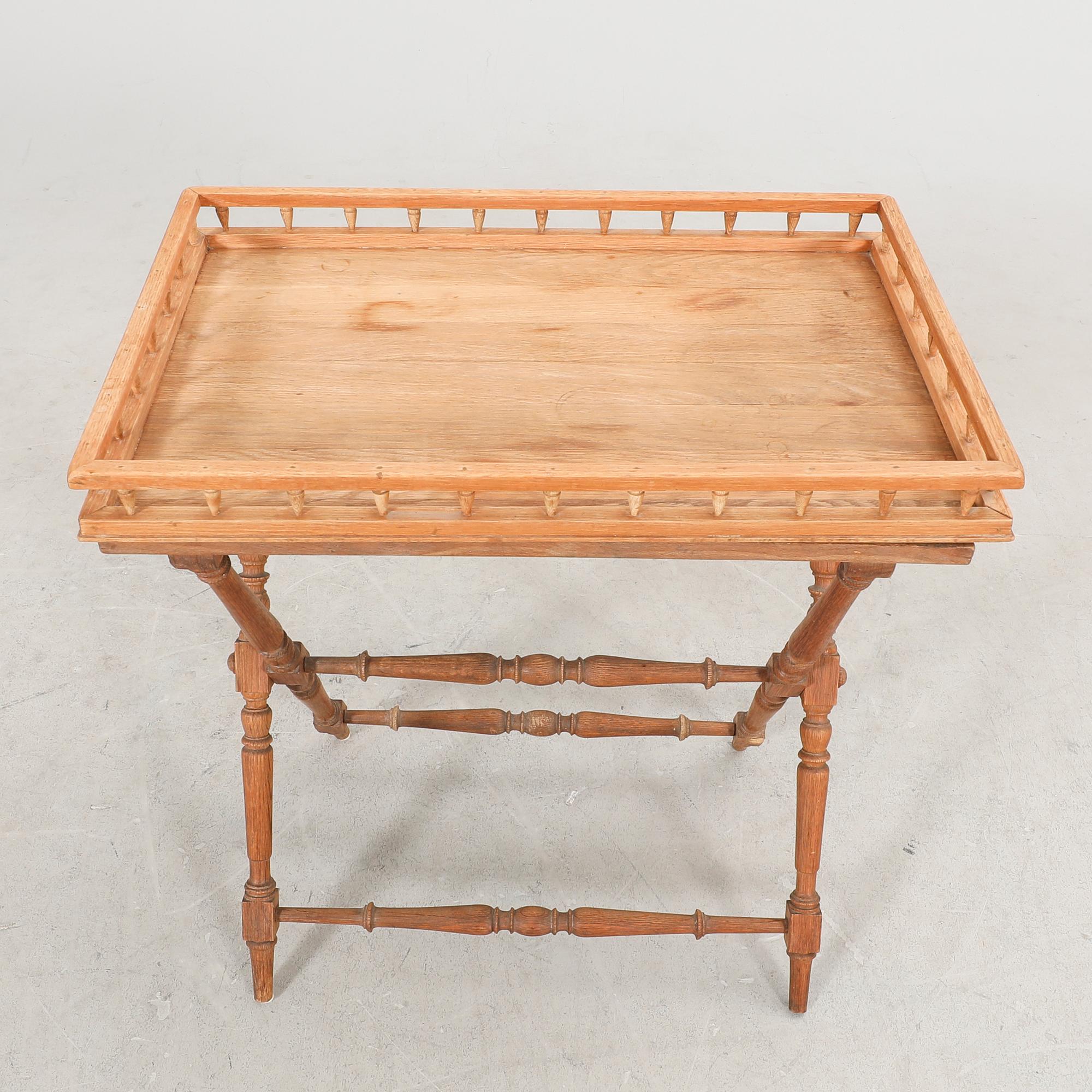 An oak tray table around 1900.