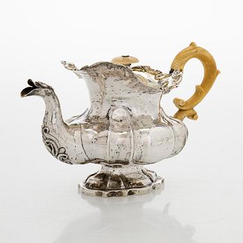 A parcel-gilt silver teapot, Moscow 1845.