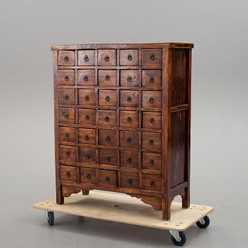 A 19th century Chinese chest of drawers/medicine cabinet.