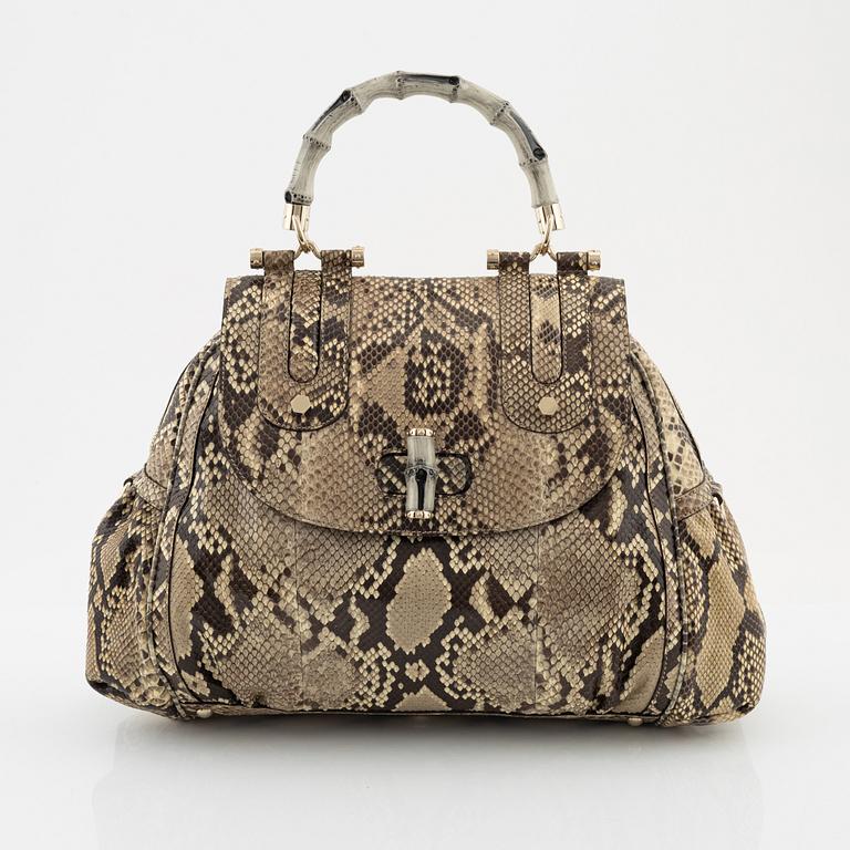 Gucci, a 'Pop Bamboo' python bag.